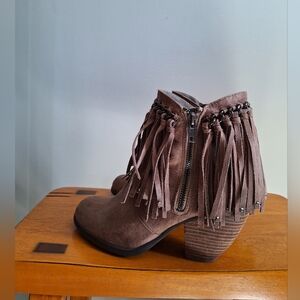 Not Rated Boots Bohemian-chic ankle  featuring a layered fringe design. Size 7